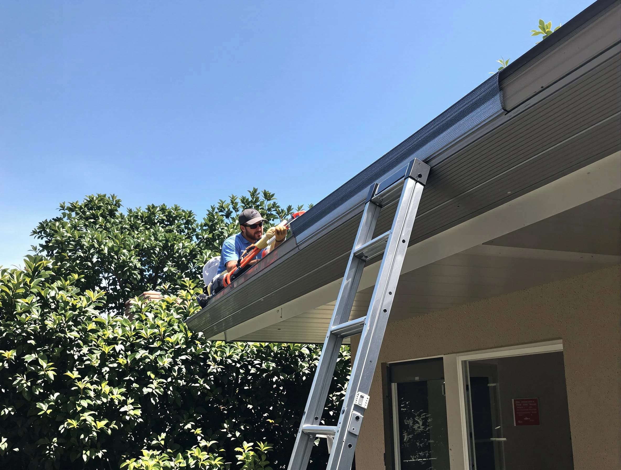 Euclid Roofing Company installing gutter guards for a homeowner in Euclid, OH